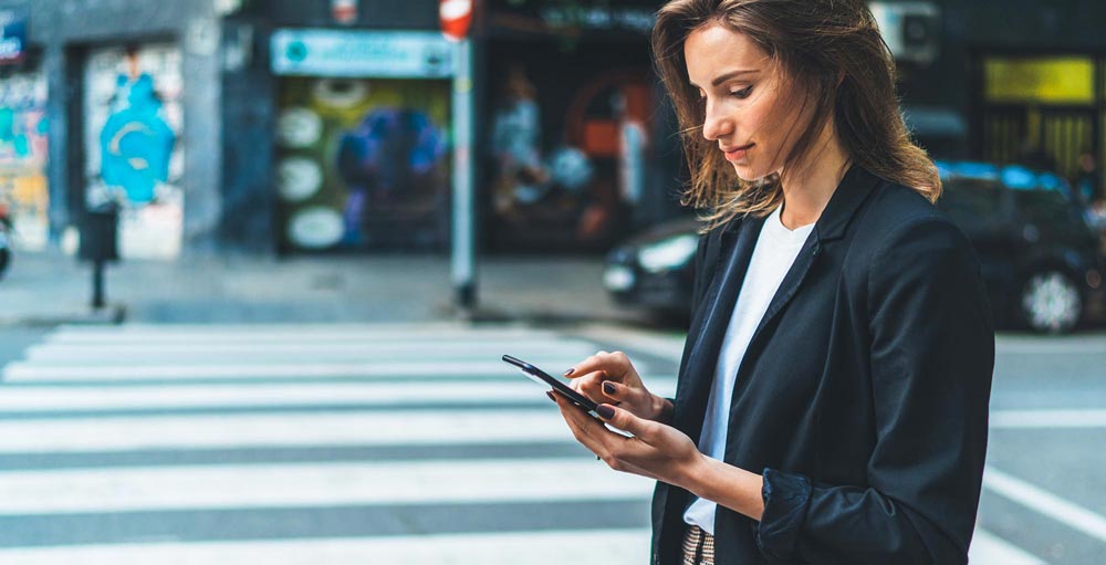 Woman in the city with mobile phone