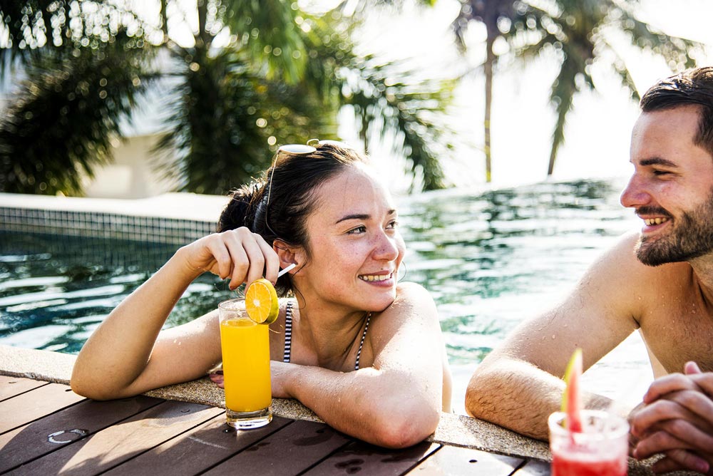 enjoy cocktail by the pool